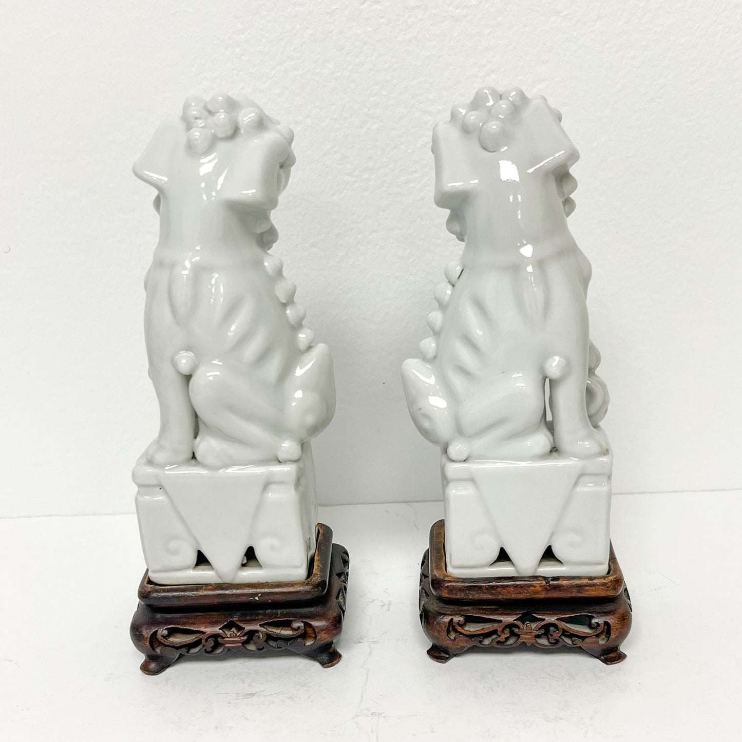 (26451) Pair of Ca. 1920 Blanc Chine Foo Dogs with Wooden Stands